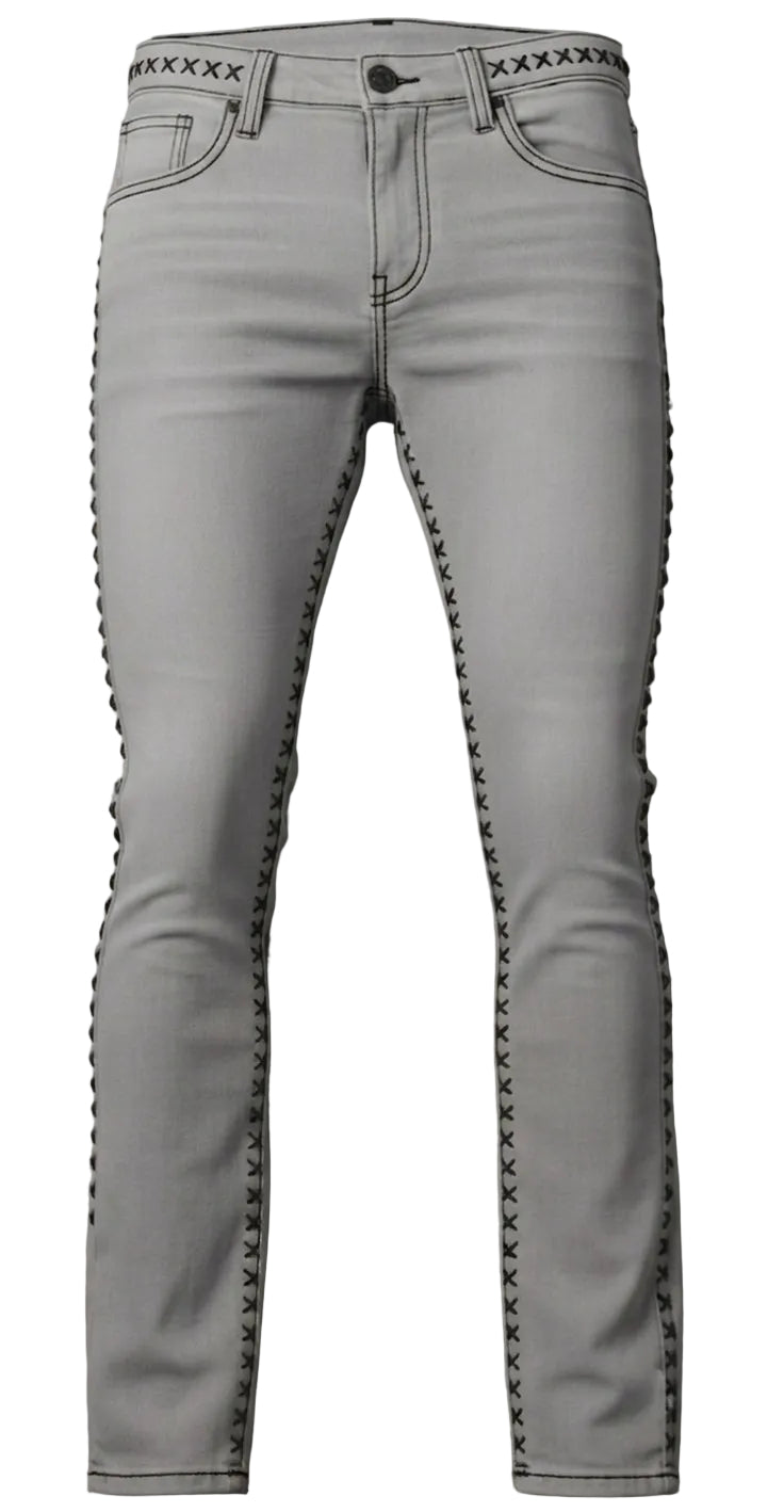 Light gray skinny jeans with black embroidered 'X' patterns running down the sides and along the waistband, displayed flat against a gray concrete background.